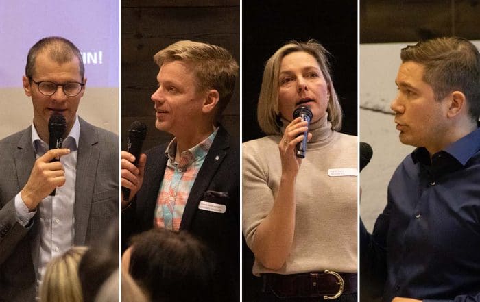 Valokuva neljästä puhujasta